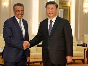 Tedros Adhanom, director general of the World Health Organization, shakes hands with Chinese President Xi Jinping before a meeting at the Great Hall of the People in Beijing, China, January 28, 2020.