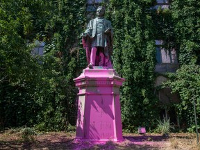 A statue of Egerton Ryerson at Ryerson University in Toronto is seen after demonstrators threw pink paint on it, on July 18.