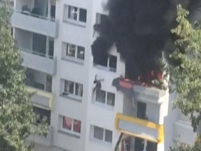 One of the boys can be seen falling from the fire in Grenoble, France.