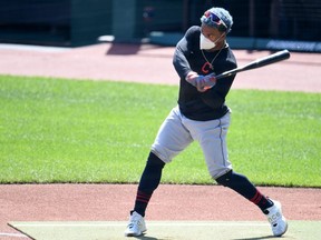 Francisco Lindor #12 of the Cleveland Indians at bat with a mask on during summer workouts at Progressive Field on July 06, 2020 in Cleveland, Ohio.