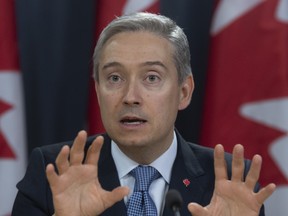 Foreign Affairs Minister Francois-Philippe Champagne responds to a question during a news conference in Ottawa on March 9, 2020.