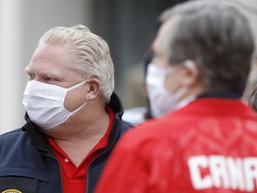 Doug Ford, Ontario's premier, wears a protective mask as he arrives at an event to hand out meals provided by Maple Leaf Sports & Entertainment (MLSE) to healthcare workers outside Centenary Hospital in Toronto, Ontario, Canada, on Friday, April 24, 2020.