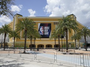 An NBA sign is posted on a basketball arena at ESPN Wide World of Sports Complex Wednesday, July 29, 2020, in Orlando, Fla.