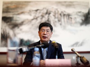 China's ambassador to Canada Cong Peiwu, seen speaking in Ottawa on Nov. 22, 2019, has said that Canada will be made to "bear the consequences" of its decision to cancel its extradition agreement with Hong Kong and to bar arms sales to the Hong Kong police.
