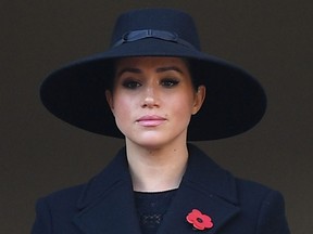 In this file photo taken on November 10, 2019 Britain's Meghan, Duchess of Sussex looks on from a balcony as she attends the Remembrance Sunday ceremony at the Cenotaph on Whitehall in central London.