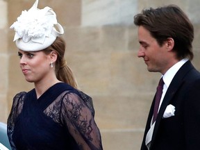 (FILES) In this file photo taken on May 18, 2019 Britain's Princess Beatrice of York (C) and Edoardo Mapelli Mozzi (R) arrive at St George's Chapel in Windsor Castle, Windsor, west of London, on May 18, 2019, to attend the wedding of Lady Gabriella Windsor to Thomas Kingston. - Prince Andrew's eldest daughter Princess Beatrice married her businessman fiance on July 17, 2020 in a private ceremony, after postponing the wedding because of the coronavirus outbreak. (Photo by Frank Augstein / POOL / AFP) (Photo by FRANK AUGSTEIN/POOL/AFP via Getty Images)