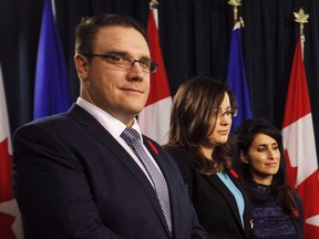 Jason Nixon, Angela Pitt and Leela Aheer stand during a press conference in Edmonton on Oct. 30, 2017. Top advisers to Alberta's environment minister were cautious about the government's plans to shrink the province's parks system and made recommendations he didn't follow.