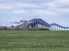 Motorists line up to cross the Confederation Bridge as the so-called tourism bubble for the Atlantic region begins, Friday July 3, 2020. Nearly two weeks after a loosened travel agreement between their provinces came into effect, Atlantic Canadian premiers are not rushing to set a date to welcome visitors from the rest of the country.