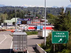 Trucks enters as most lanes remain closed at a border crossing into Canada from the U.S., where the shared border has been closed for nonessential travel in an effort to prevent the spread of the coronavirus, Thursday, May 7, 2020, in Blaine, Wash.