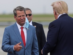 U.S. President Donald Trump is greeted by Georgia Governor Brian Kemp as he arrives at Hartsfield-Jackson Atlanta International Airport in Atlanta, Georgia, U.S.,  July 15, 2020.