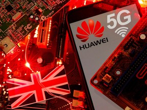 The British flag and a smartphone with a Huawei and 5G network logo are seen on a PC motherboard in this illustration