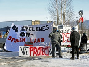 Supporters of the Indigenous Wet'suwet'en Nation's hereditary chiefs camp at a railway blockade as part of protests against British Columbia's Coastal GasLink Pipeline, in Edmonton, on Feb. 19.
