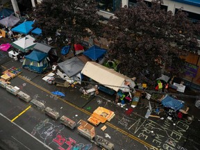 City crews dismantle the Capitol Hill Organized Protest (CHOP) area outside of the Seattle Police Department's vacated East Precinct on July 1, 2020 in Seattle, Washington. Police reported making at least 31 arrests since clearing the CHOP area this morning.