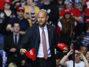 In this Thursday, March 28, 2019, file photo, Brad Parscale, manager of President Donald Trump's reelection campaign, throws "Make America Great Again," hats to the audience before a rally in Grand Rapids, Mich.