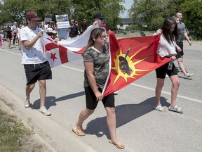 People walk to honour Rodney Levi in Red Bank, New Brunswick on Friday June 19, 2020. Indigenous leaders in New Brunswick are renewing a call for an independent, Indigenous-led public inquiry to investigate systemic racism and two recent police shootings in the province.