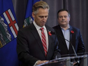 United Conservative Party leader Jason Kenney, right, looks on as MLA Dave Rodney announces his resignation in Calgary, Alta., Sunday, Oct. 29, 2017. A former Alberta legislature member who gave up his seat for Alberta Premier Jason Kenney has a new government job in Texas. Kenney has appointed Dave Rodney to the job of Alberta's agent general.