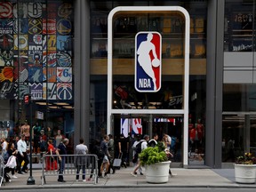 The NBA logo is displayed as people pass by the NBA Store in New York City, U.S.