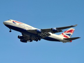 A British Airways Boeing 747-400 flies into Heathrow Airport in west London May 12, 2011.