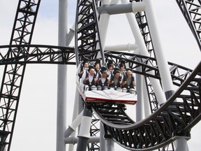 People react as they ride on Fuji-Q Highland amusement park world's steepest roller coaster "Takabisha" with a free falling angle of 121 degrees.