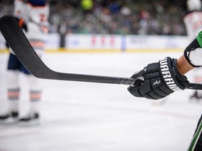 A view of the gloves and stick of Dallas Stars defenseman Andrej Sekera (5) during the game between the Stars and the Oilers at the American Airlines Center.