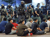 Police detain protesters against the new security law during a march marking the anniversary of the Hong Kong handover from Britain to China, Wednesday, July. 1, 2020, in Hong Kong.