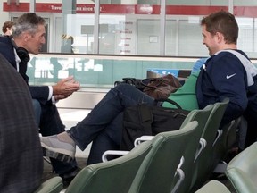 Conservative Leader Andrew Scheer, right, and Manitoba Premier Brian Pallister are shown not wearing masks at Pearson Airport in Toronto on Tuesday, July 7, 2020.