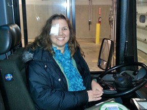 Liliana Di Cienzo is seen in a bus in the Oakville Transit garage in Oakville, Ont., in a Dec. 4, 2013 handout photo. The photo was taken after Di Cienzo lost her right eye to cancer and, as a result, her driver's licence. A city bus driver whose licence was revoked after she lost her eye to cancer has won her battle to have the relevant provincial regulations declared unconstitutional.