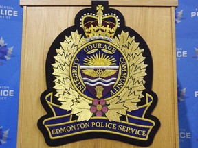 An Edmonton Police Service logo is shown at a press conference in Edmonton, Oct. 2, 2017. Edmonton police are investigating a fatal collision that left three people dead. Officers responded to the single-vehicle collision around 2:20 a.m near Calgary Trail and 55 Avenue in the city.