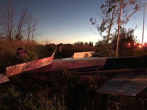 A small plane is shown upside down following a crash near Ottawa on Tuesday, July 28, 2020 in this handout photo. Two people aboard a small plane managed to escape the aircraft after it crashed west of Ottawa near Highway 417.