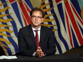 Health Minister Adrian Dix looks during a press conference in the rotunda at Legislature in Victoria, B.C., on Wednesday May 6, 2020. British Columbia's health minister says the province has hired more staff and increased operating-room hours to catch up on cancelled surgeries but a significant surge in COVID-19 cases could impact recovery.