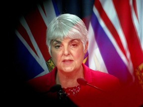 Minister of Finance Carole James speaks to the media during a press conference at Legislature in Victoria, B.C., on Monday, March 23, 2020.