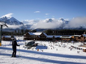 Skiers enjoy Lake Louise ski resort in Lake Louise, Alta., Saturday, Nov. 24, 2018. An Alberta judge has upheld a $2.1 million fine against a world-renowned ski resort for cutting down endangered trees nearly seven years ago.