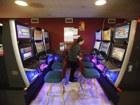 A bar server, organizes the VLT area at The Royal Canadian Legion, St James Branch No. 4 in Winnipeg on Thursday, November 8, 2018. The Supreme Court of Canada is slated to decide this morning whether a class action that takes aim at video lottery terminals can proceed and, if so, on what grounds.