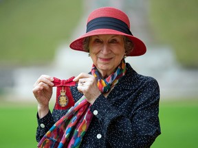 Canadian novelist Margaret Atwood shows her medal after being made a Member of the Order of the Companions of Honour for services to literature by Queen Elizabeth II at Windsor Castle on October 25, 2019.