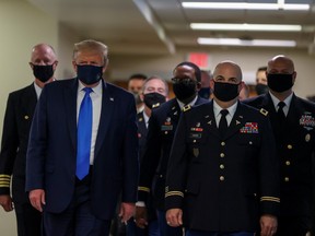 U.S. President Donald Trump wears a mask while visiting Walter Reed National Military Medical Center in Bethesda, Maryland, U.S., July 11, 2020.