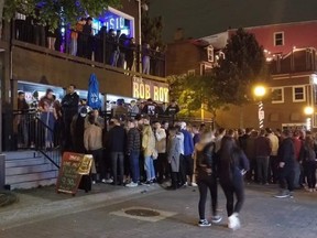 Photos shared widely online Monday show dozens of people crowded outside and on the balconies of popular George Street bars The Rob Roy and Konfusion.