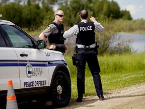 A police road block near the scene of a plane crash on RR232 east of Leduc, Alberta on Friday July 3, 2020.