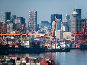 Containers sit stacked at the DP World and Global Container Terminals docks on Vancouver Harbour on March 21, 2020.