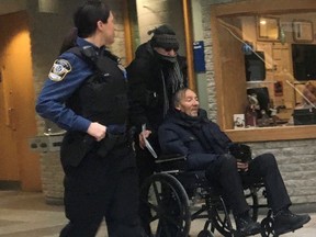 Francois Lamarre, a retired Montreal police and former minor league hockey coach in Greenfield Park, Que., appears for his arraignment at the courthouse in Longueuil, Que., Thursday, Dec.19, 2019. Longueuil police say the retired Montreal police officer arrested last December on sex-related charges has died. Police say Lamarre passed away of natural causes on Sunday at a hospital south of Montreal.