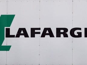 A logo of Lafarge, the world's largest cement maker, is pictured outside of a facility, in Paris, France, Friday Sept. 8, 2017. Construction materials giant Lafarge Canada says it fired an employee after a discriminatory and hateful act took place at a Montreal work site.