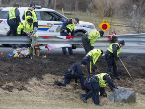 RCMP investigators search for evidence at the location where Const. Heidi Stevenson was killed along the highway in Shubenacadie, N.S. on Thursday, April 23, 2020.
