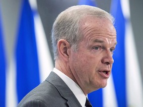 Nova Scotia Justice Minister Mark Furey fields question as he holds a briefing in Halifax on Tuesday, April 3, 2018. Furey says legalities and technicalities are causing delays as the provincial and federal government work out how they will jointly deliver some sort of inquiry or review into the mass shooting in April that claimed the lives of 22 Nova Scotians.THE CANADIAN PRESS/Andrew Vaughan