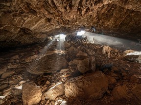 Researchers entering at a cave in Zacatecas in central Mexico, which contained stone tools and other evidence of the presence of prehistoric human populations,  are seen in this image released on July 22, 2020.