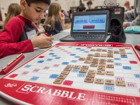 Grade five student Isaac Mirza tallies up his points. Nellie Carlson School hosted about 100 students from four schools for the fourth annual Edmonton school Scrabble tournament on March 11, 2020.