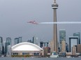 The Canadian Forces Snowbirds fly past the Toronto skyline on May 10.