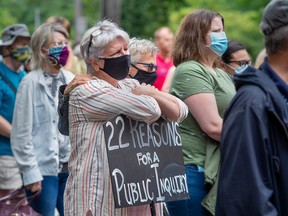 Protesters gather in Halifax's Victoria Park to demand a public inquiry into the deadly mass shootings that claimed 22 lives in Nova Scotia last April, on Monday, July 27, 2020.