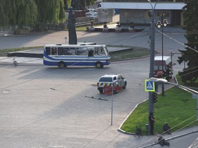 Police officers take up positions during an operation to rescue passengers of an intercity bus who have been taken hostage by an armed man in the city of Lutsk, some 400 kilometres (250 miles) from the capital Kiev, on July 21, 2020.