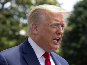 U.S. President Donald Trump speaks to members of the media as he departs the White House in Washington, D.C., U.S., on Saturday, May 30, 2020.