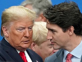President Donald Trump talks with Prime Minister Justin Trudeau at the NATO summit in Watford, Britain, December 4, 2019.