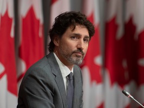 Prime Minister Justin Trudeau listens to a question during a news conference, Wednesday, July 8, 2020 in Ottawa.
